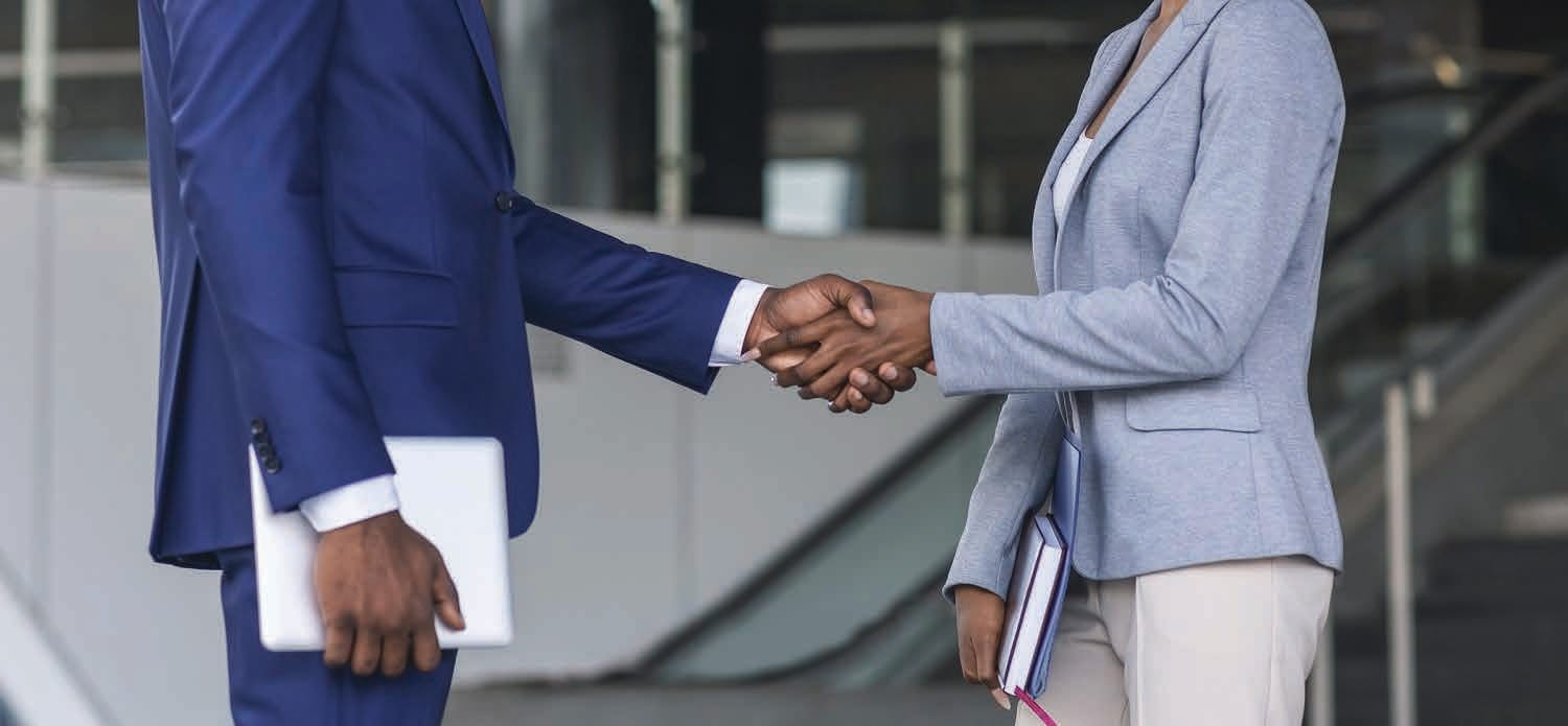 Masterfound Security representative shaking hands with a client